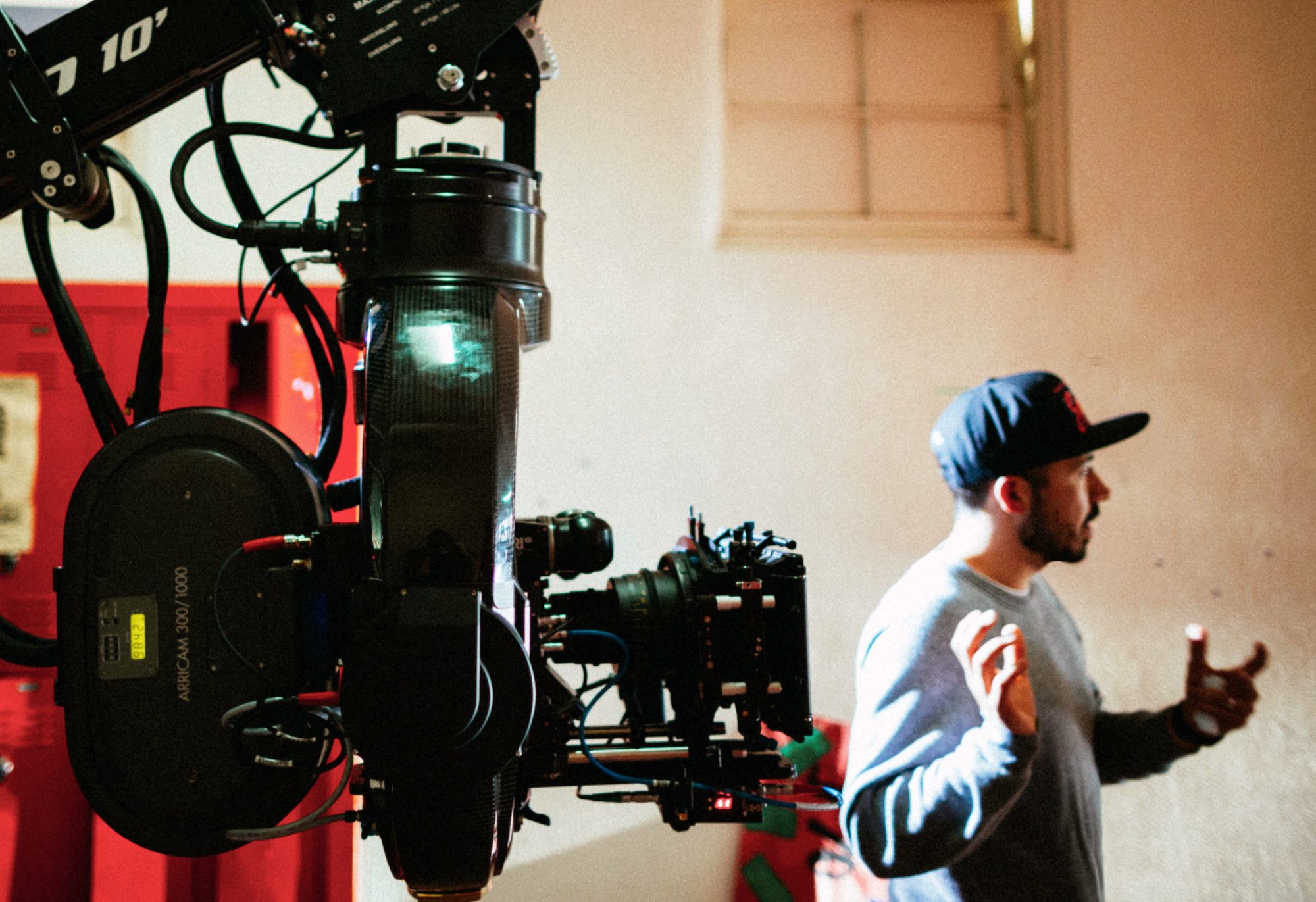 Directing beside a 35mm camera on a crane arm