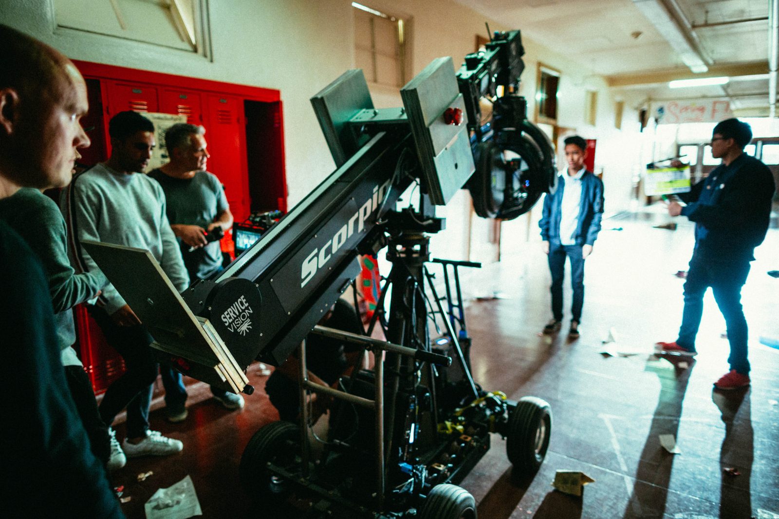 Scorpio crane rig set up in a school hallway beside red lockers