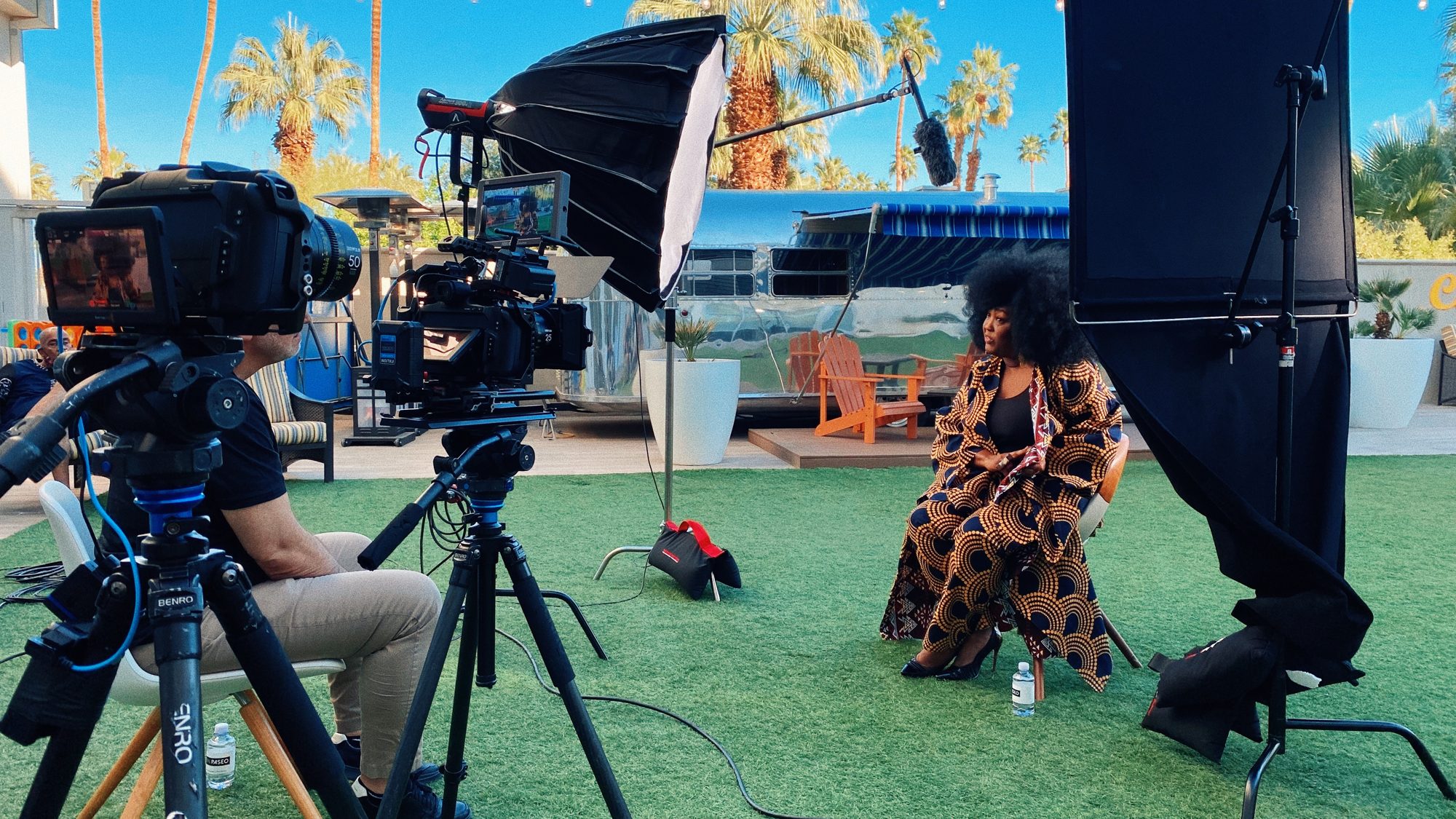 Outdoor interview setup beside an Airstream trailer